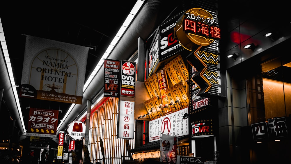 man in black jacket standing beside store