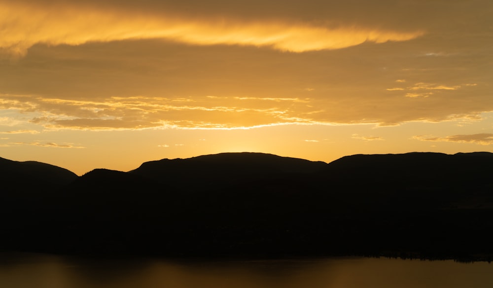 silhouette of mountain during sunset