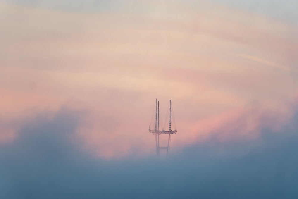 white wind turbine under blue sky