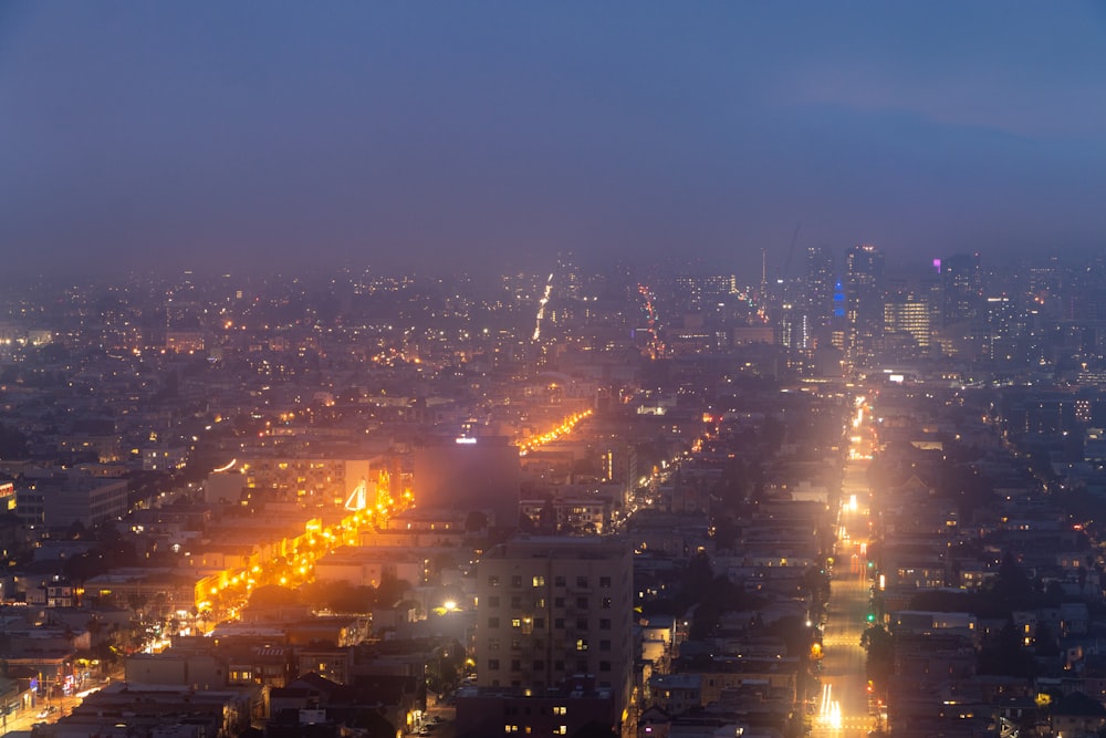 city with high rise buildings during night time