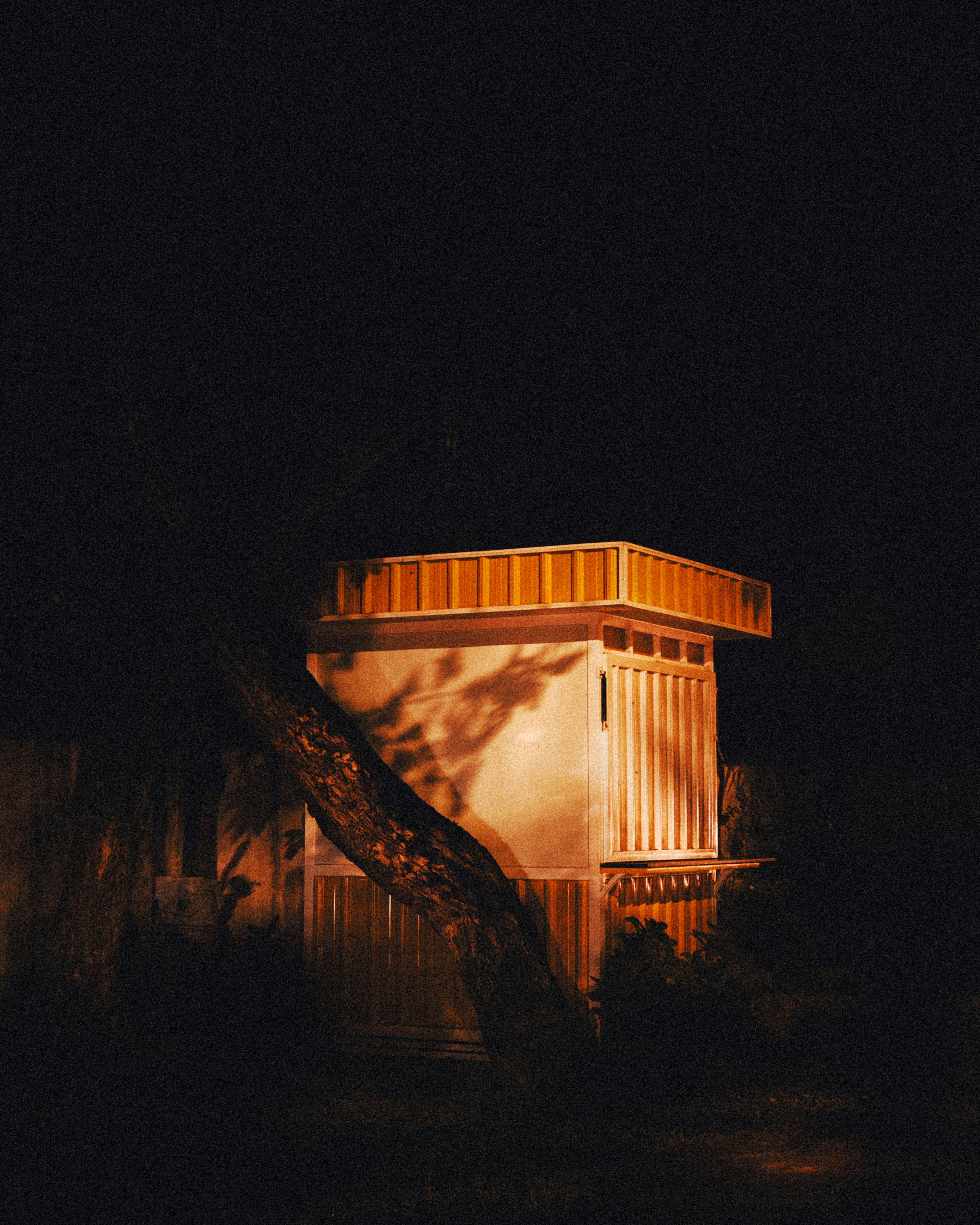 white and brown wooden house during night time