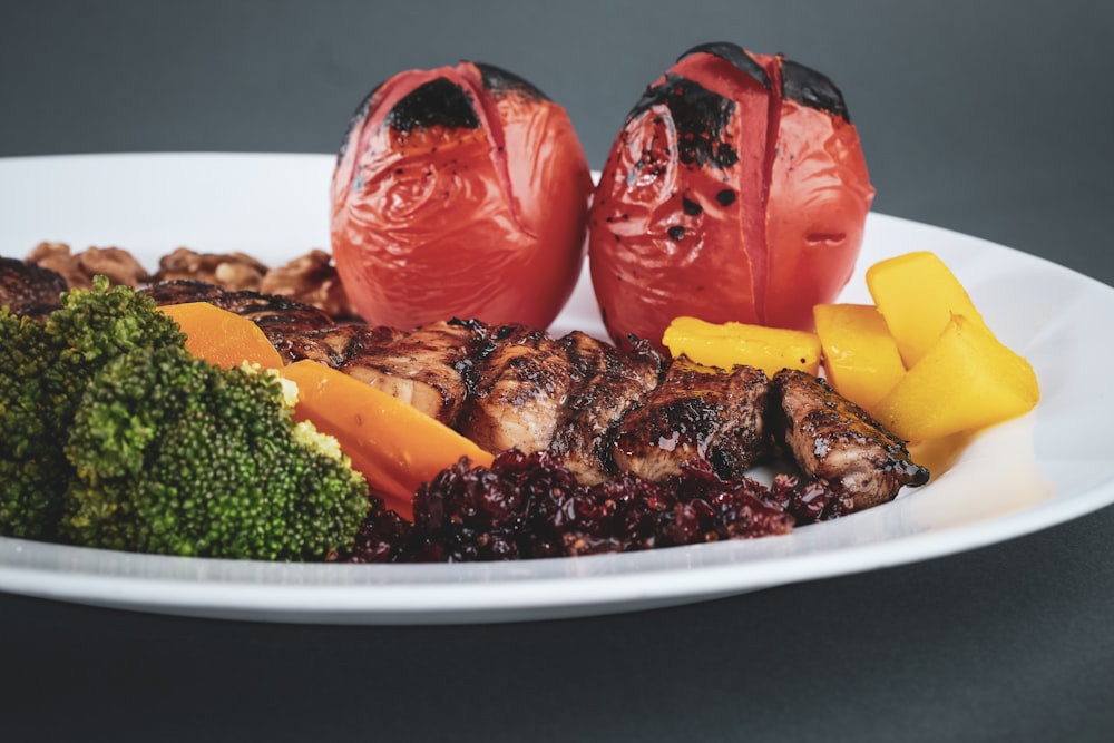 sliced fruits on white ceramic plate