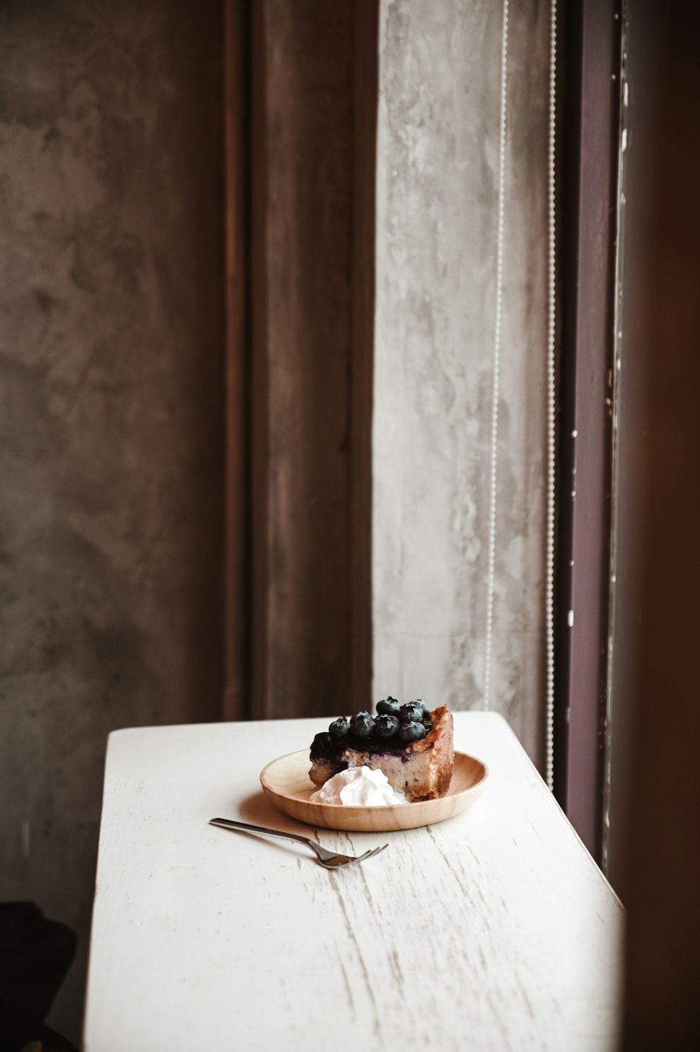 brown and white cake on white ceramic plate