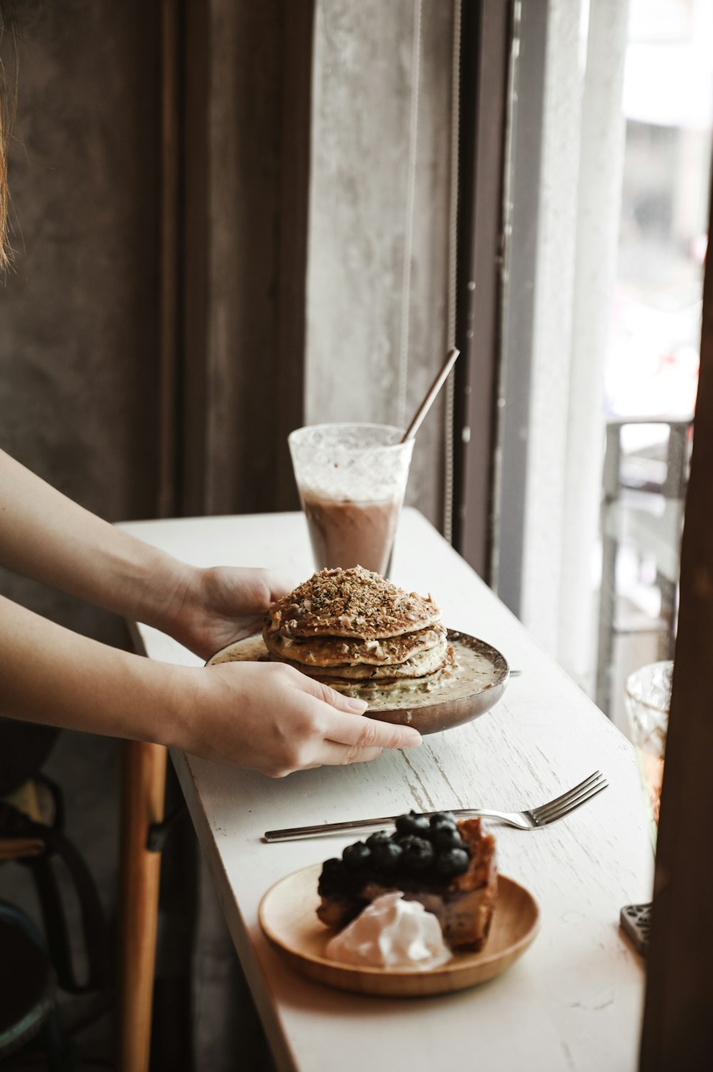 person holding a cup of ice cream