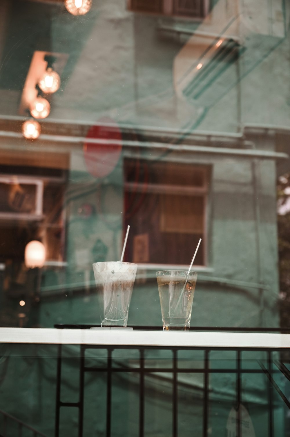 clear drinking glass with straw