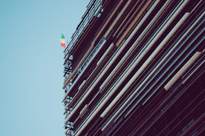 Traditional scaffolding setup around a historic building facade in Genoa