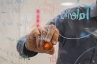 person holding orange flower petals