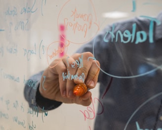 person holding orange flower petals