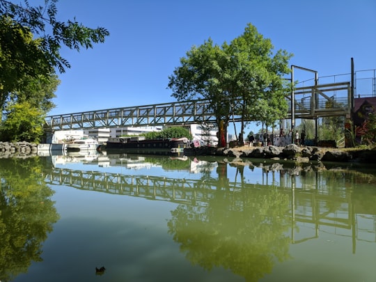 people on bridge over river during daytime in PORT SUD France