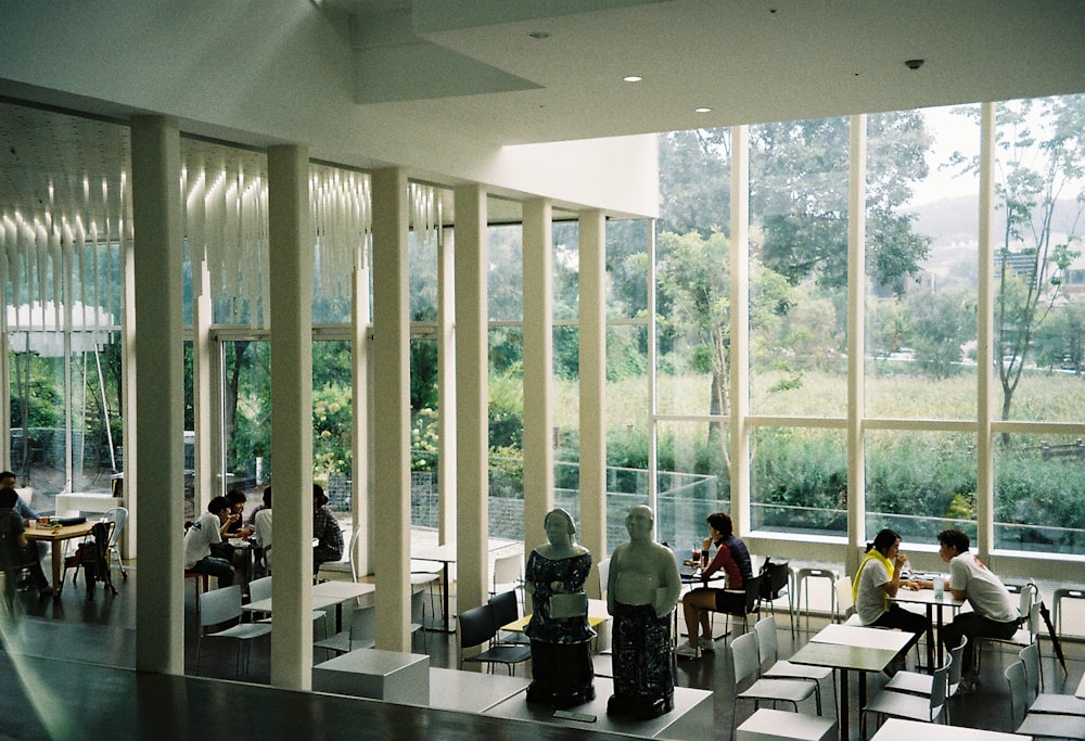 people sitting on chair inside room