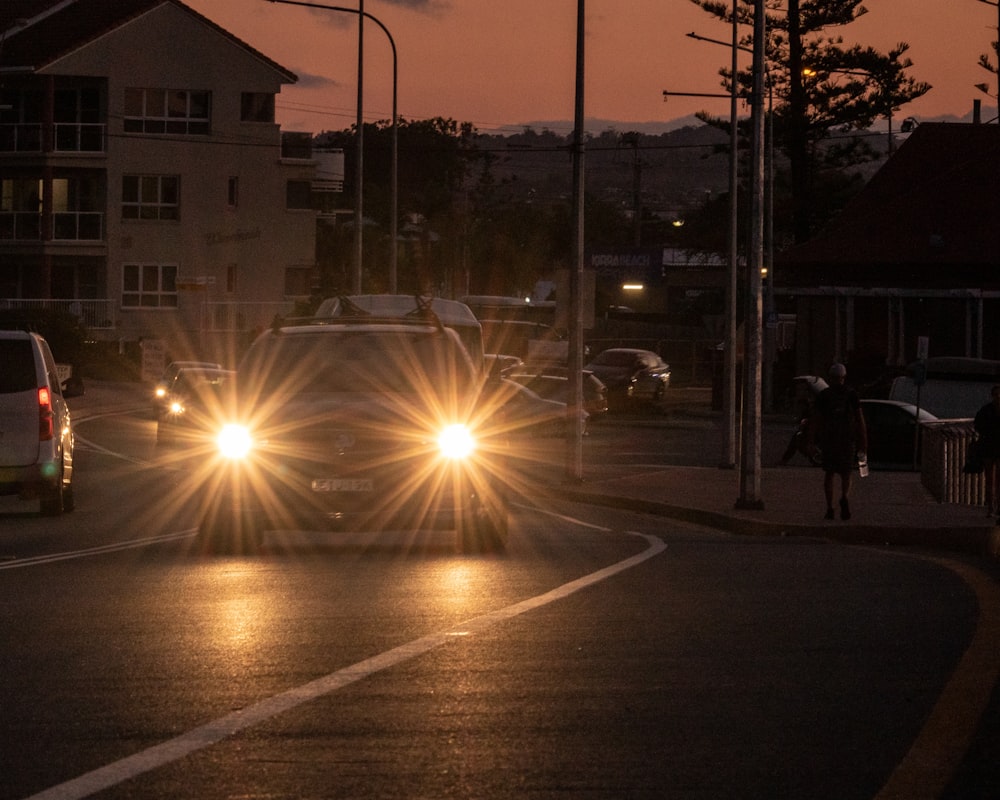 people walking on sidewalk during night time