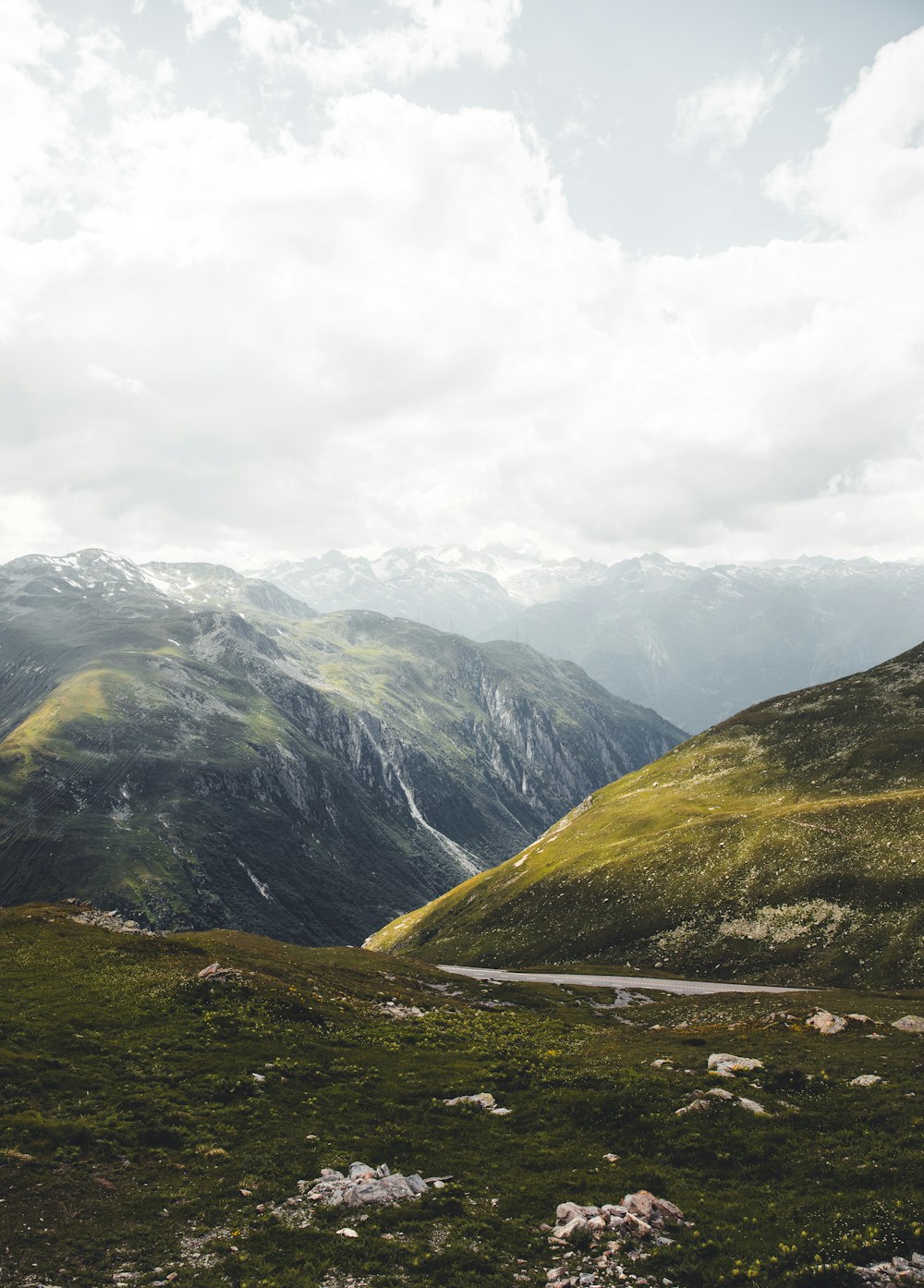 green and brown mountains under white clouds during daytime