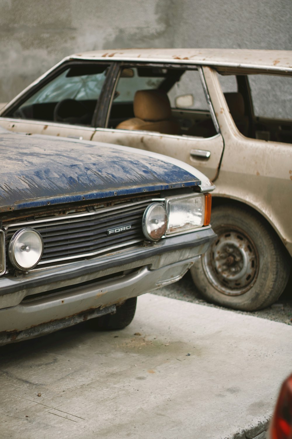 blue car on gray concrete road