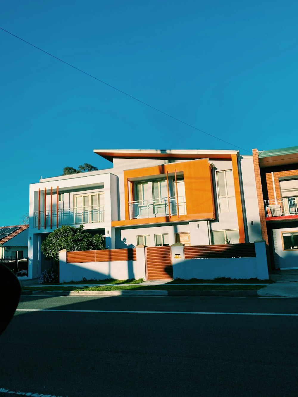 white and brown concrete house under blue sky during daytime