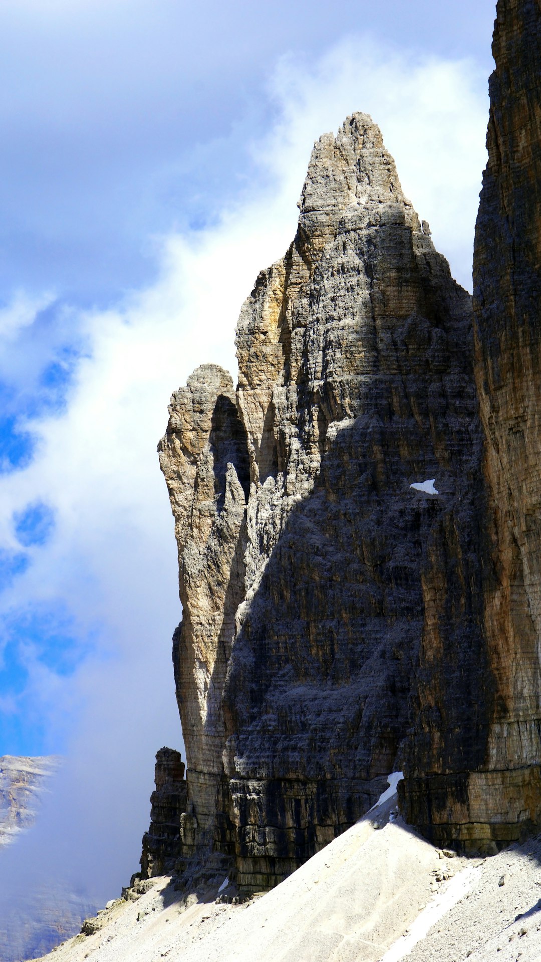 brown rocky mountain under white clouds