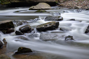 water falls with rocks on the side