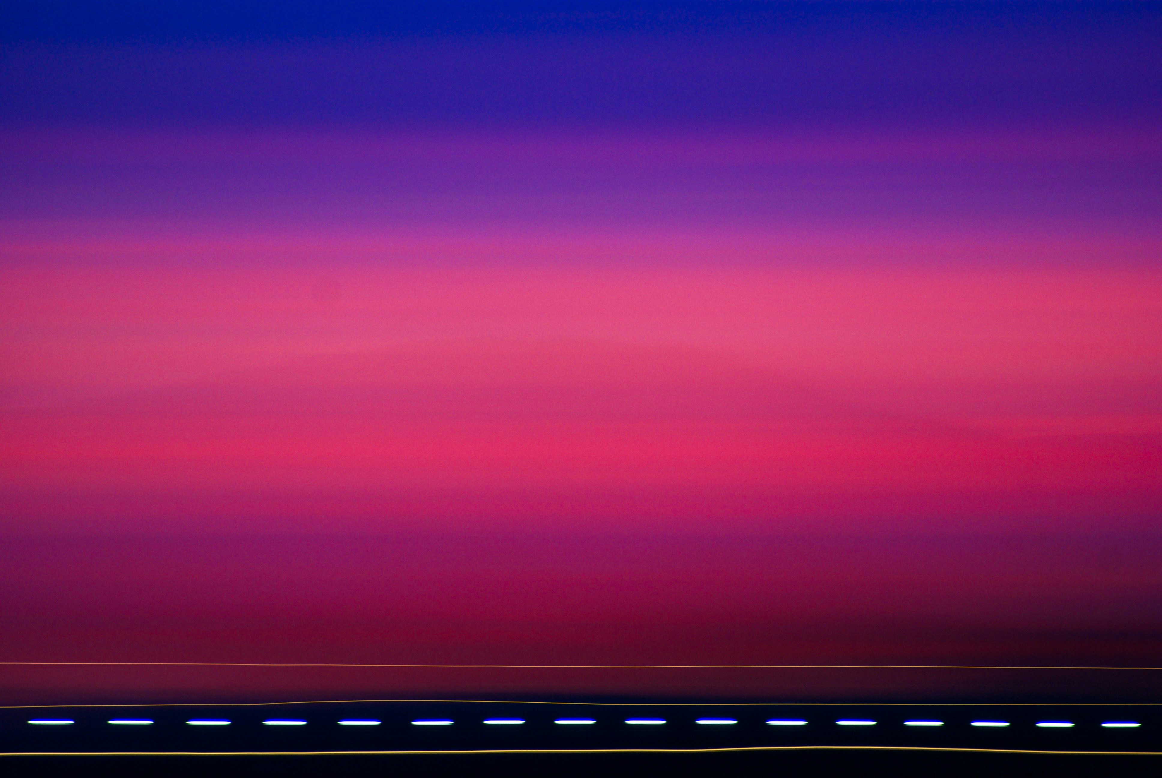 red and blue sky over sea