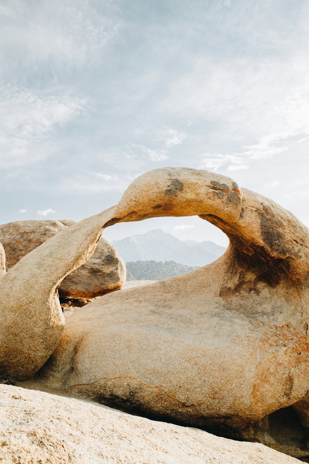 a large rock formation with a sky background