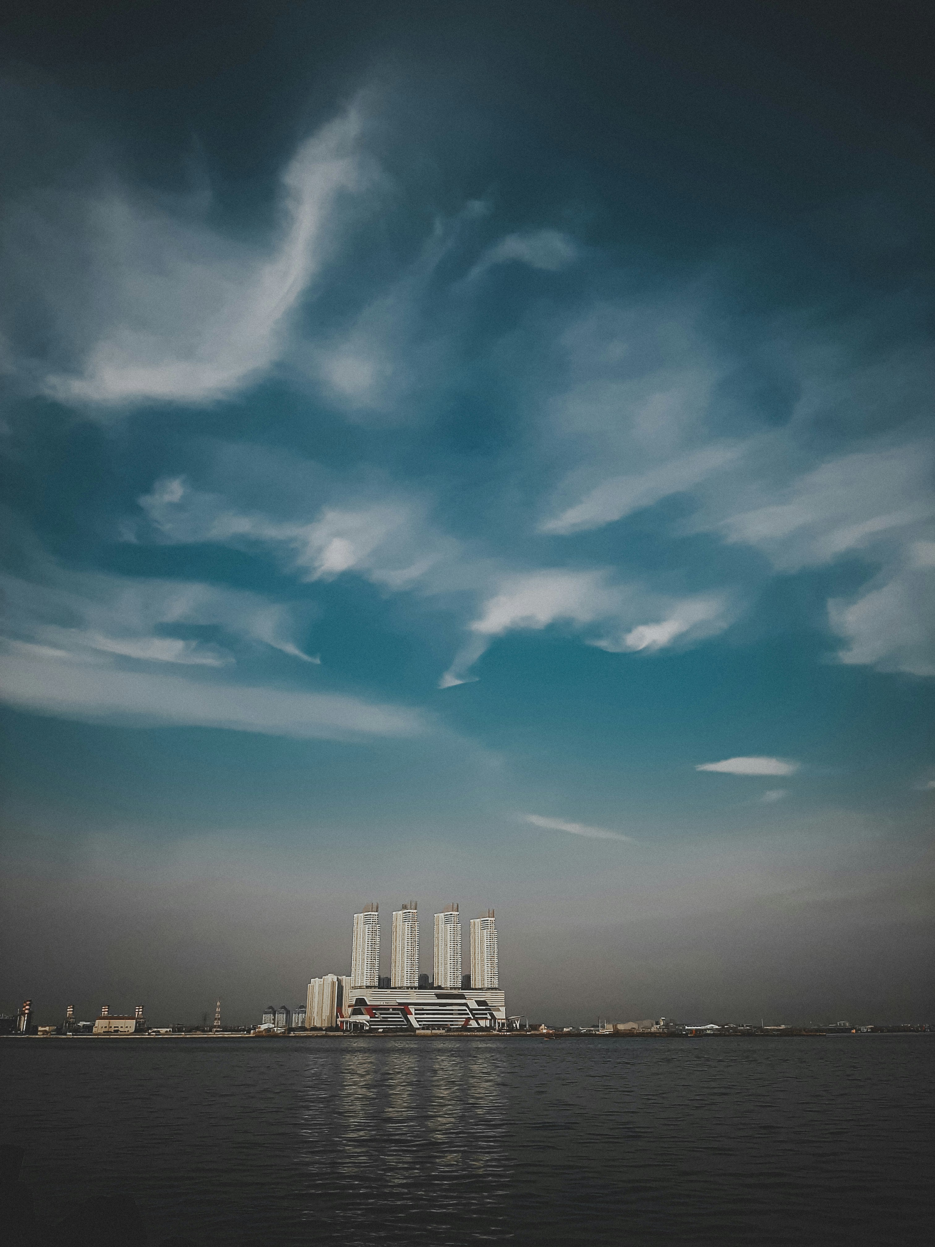 City skyline under blue sky and white clouds during daytime photo ...