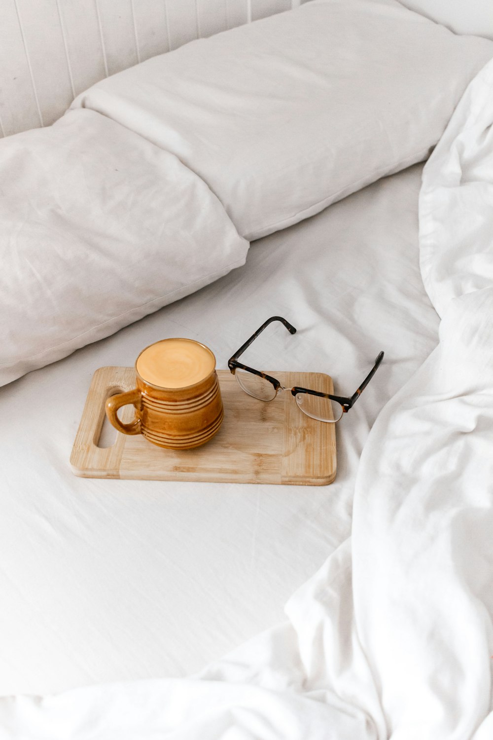 brown ceramic mug on brown wooden tray