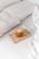 An artistic representation of a curated luxury item in a calm setting.