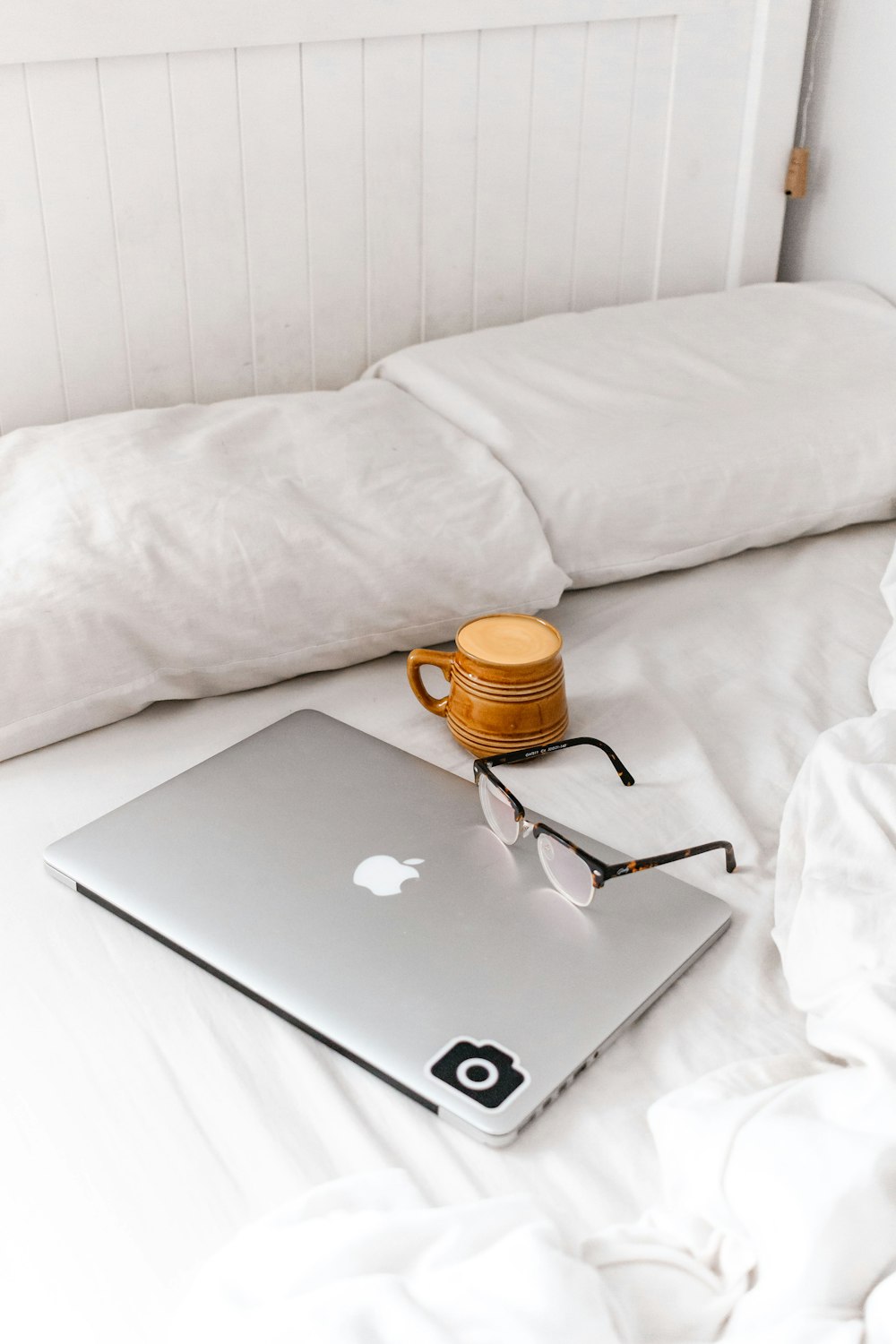 macbook air on white bed