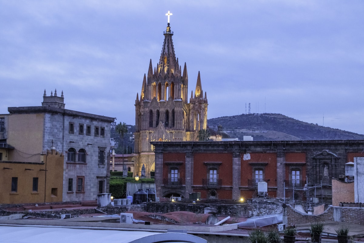 Stone church building in San Miguel de Allende at dusk against an open sky