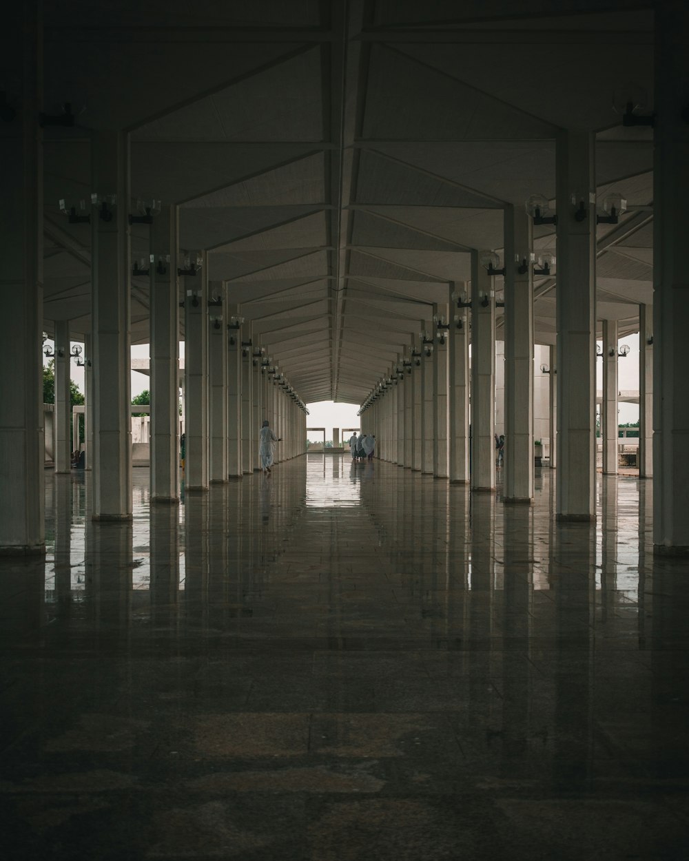 white and brown hallway with no people