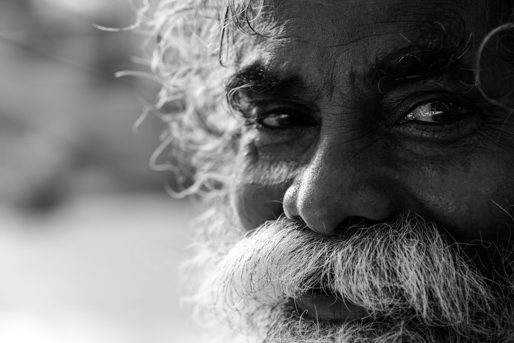 grayscale photo of mans face