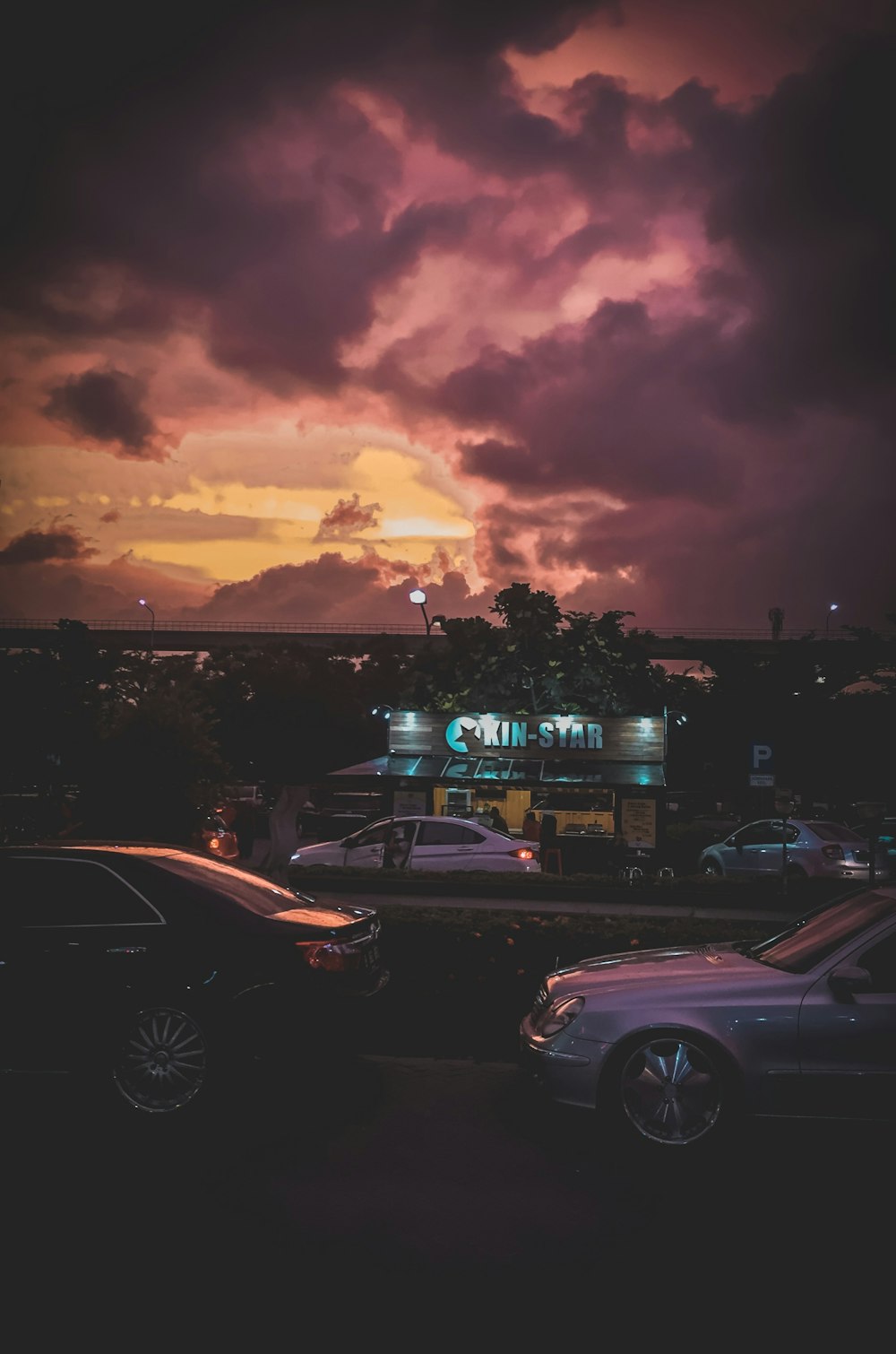 cars on road during sunset