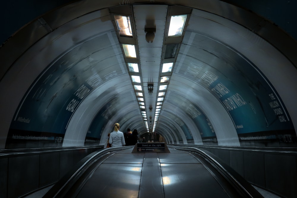 people walking on tunnel during daytime