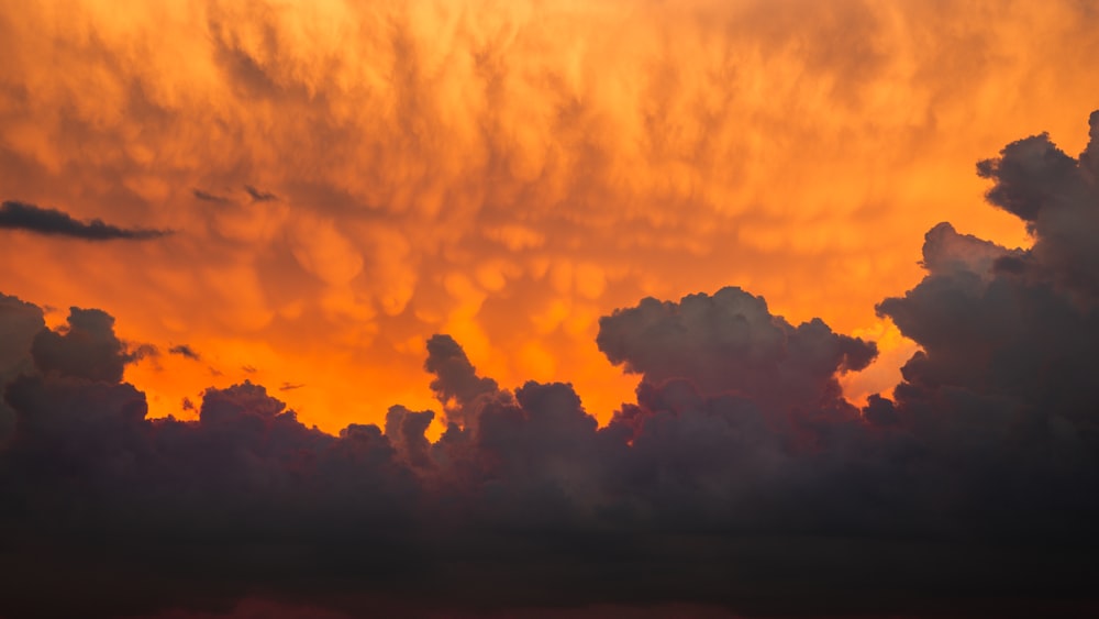 orange and black clouds during sunset