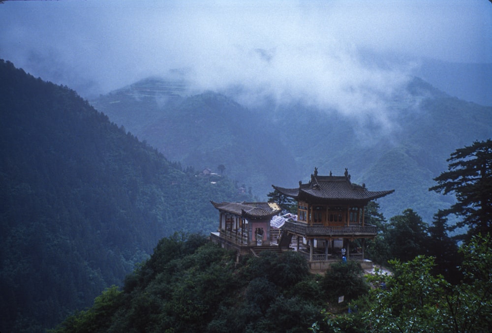 brown and white house on top of mountain