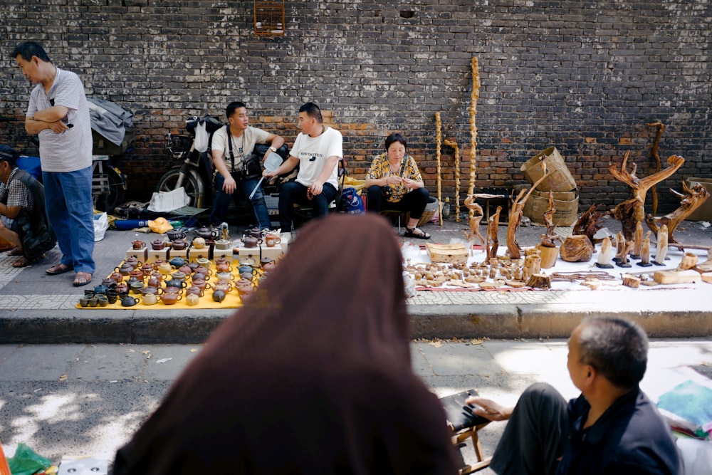 people sitting on floor during daytime