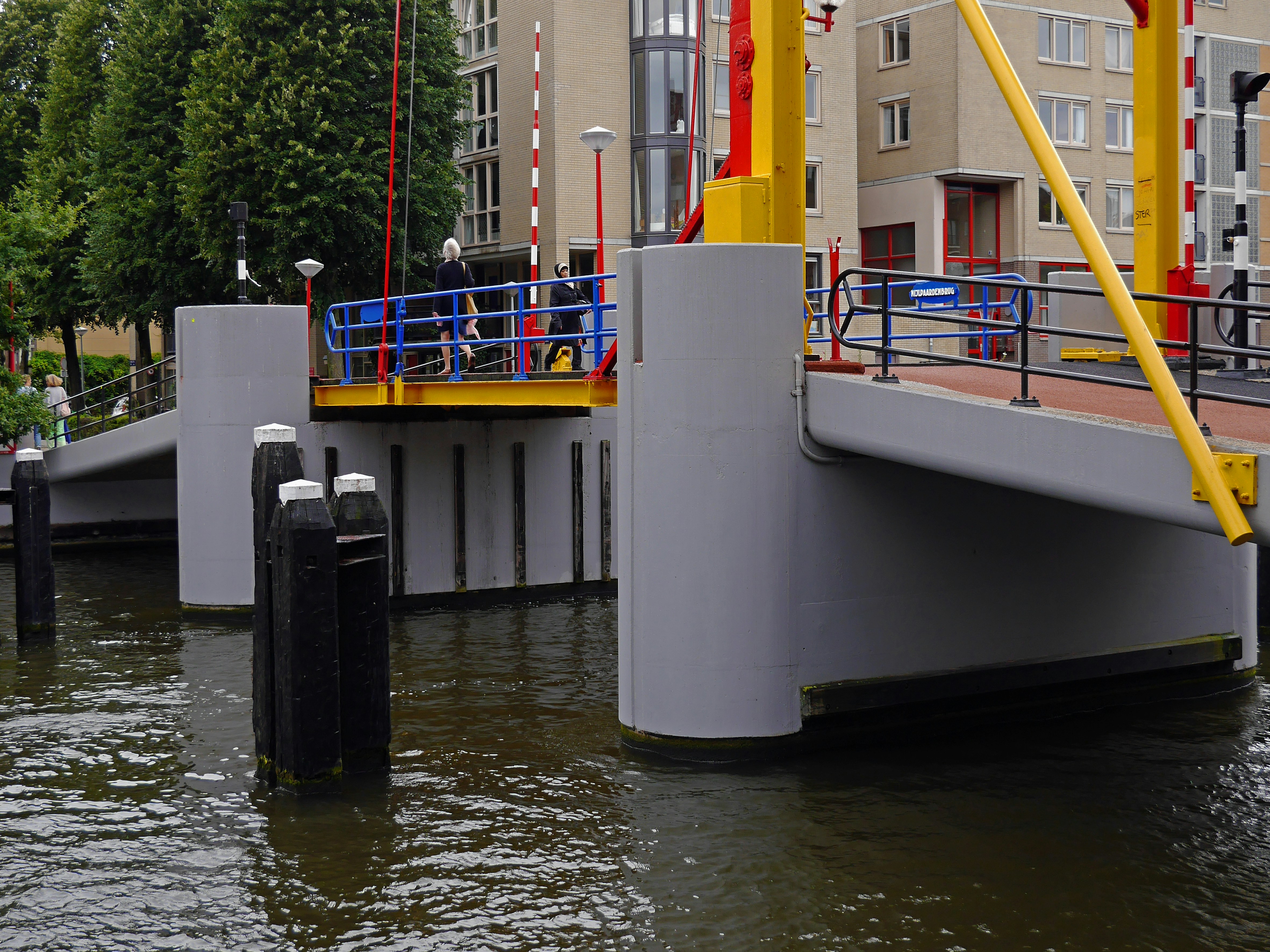 white and blue boat on water