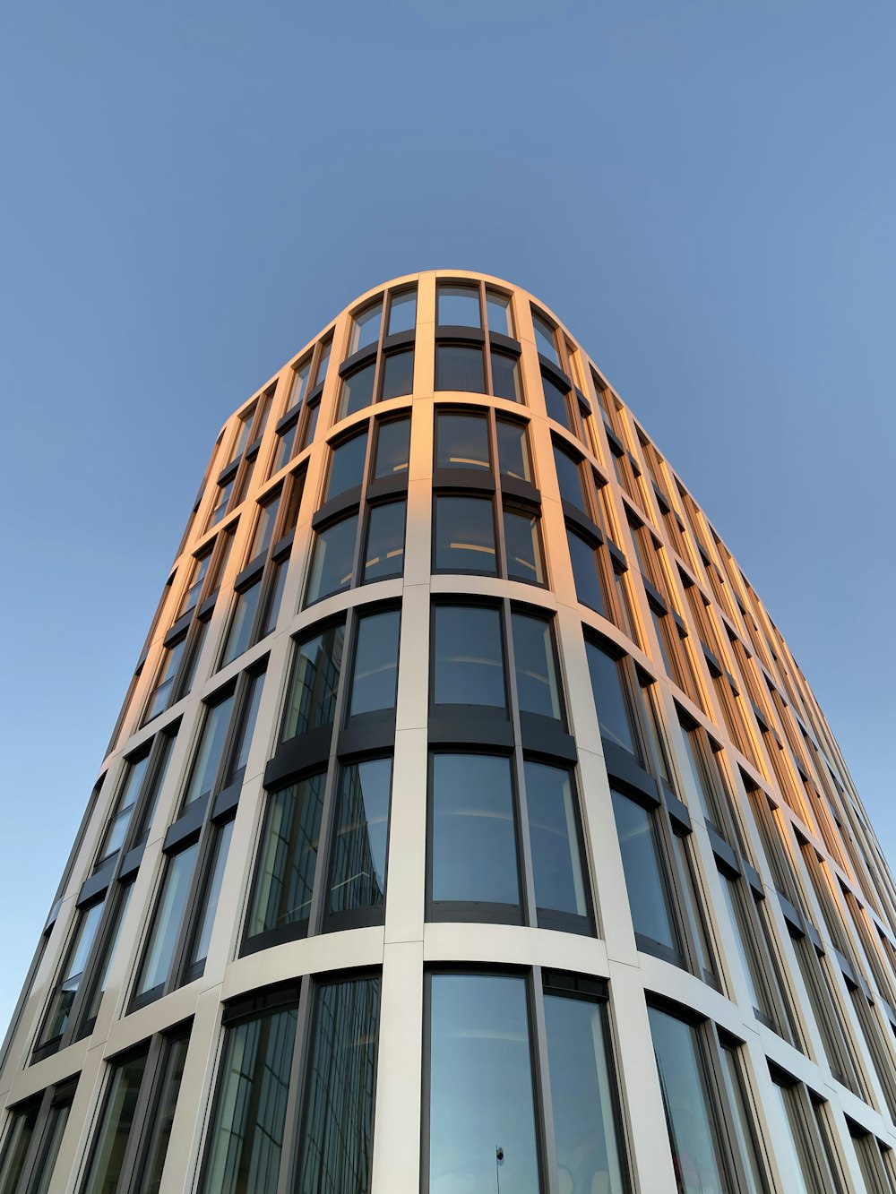 brown and white concrete building under blue sky during daytime