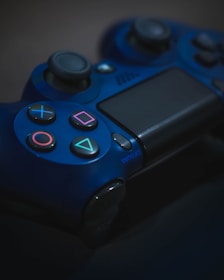 A close-up of a multiplayer game card featuring colorful avatars and glowing electric blue highlights on a dark background.