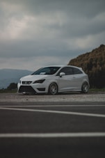 white mercedes benz coupe on road during daytime