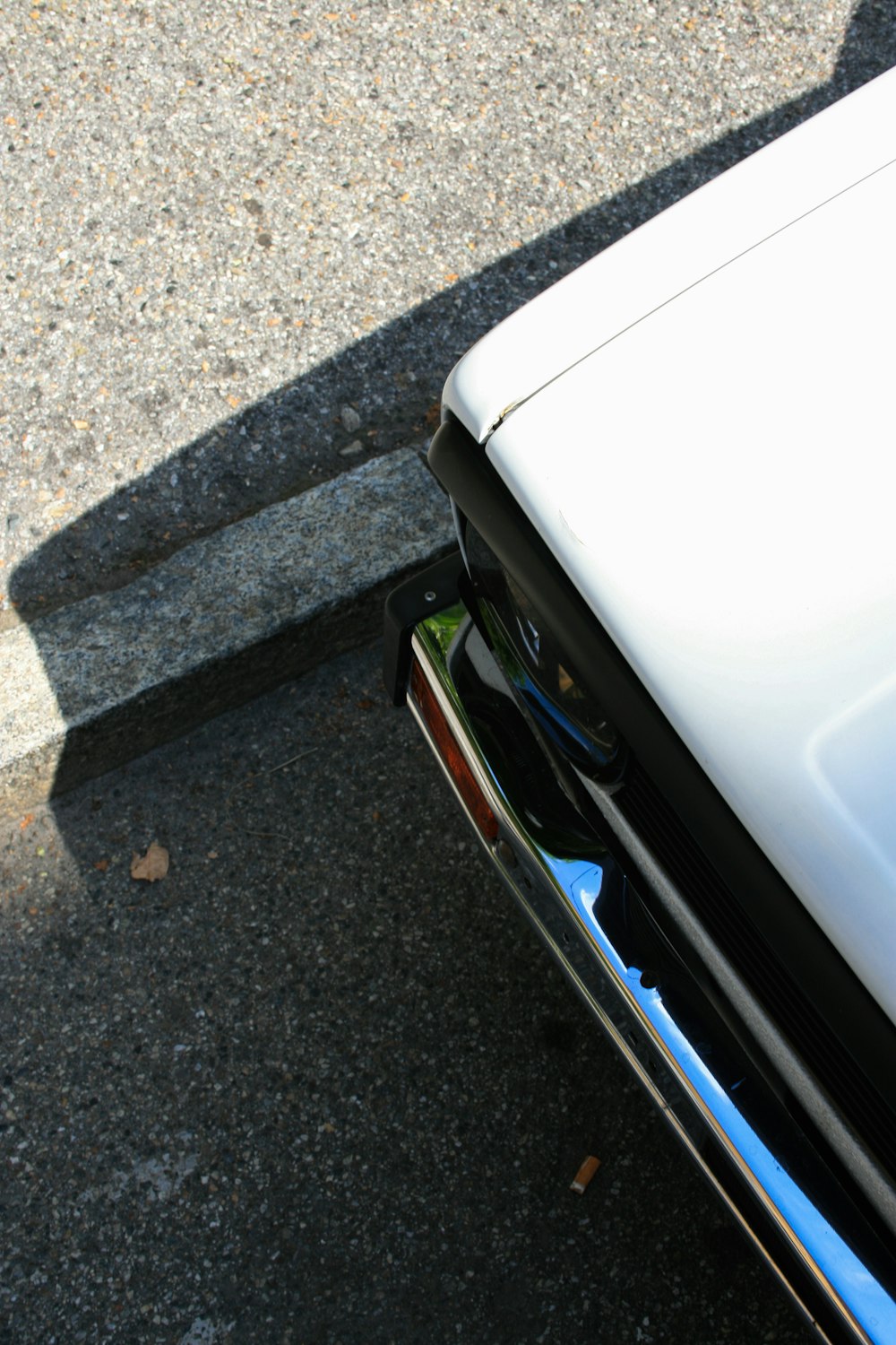 white car on gray asphalt road