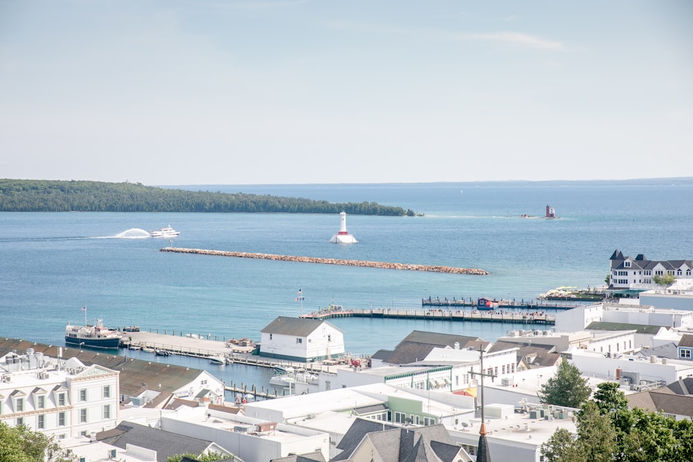 white and gray houses near sea during daytime