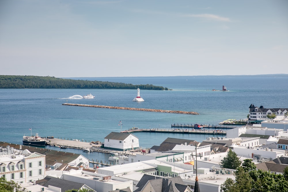 white and gray houses near sea during daytime