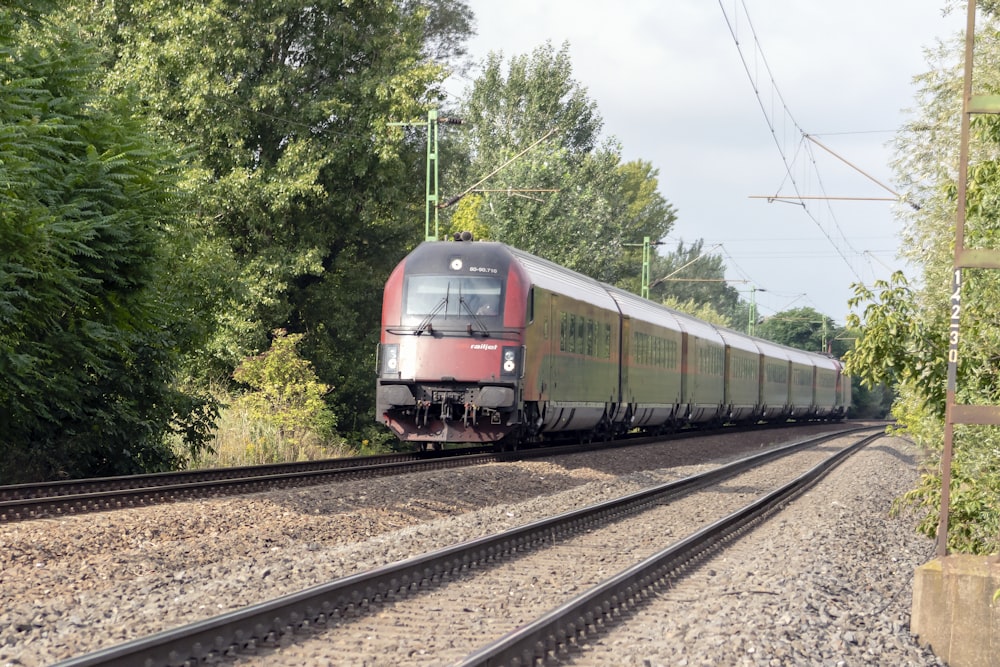 gray and red train on rail tracks