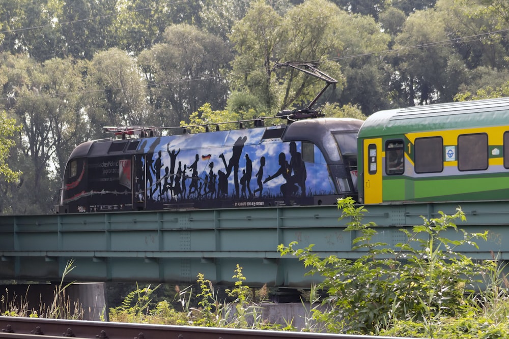 yellow and black train on rail tracks