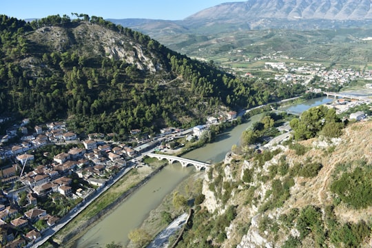 aerial view of city on mountain during daytime in Berat Albania