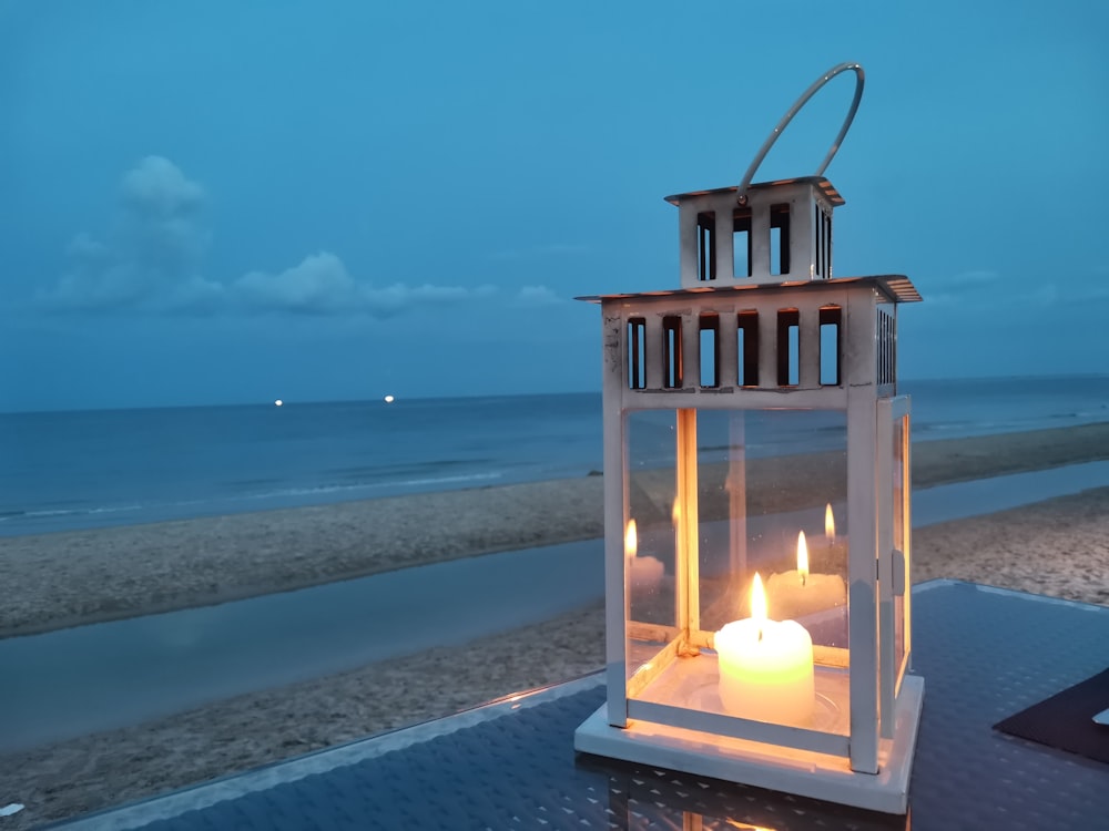 brown wooden candle holder on gray concrete surface