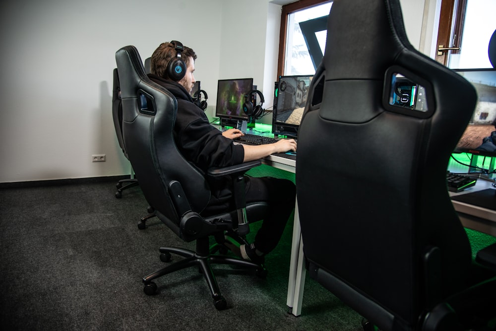 woman in black jacket sitting on black office rolling chair