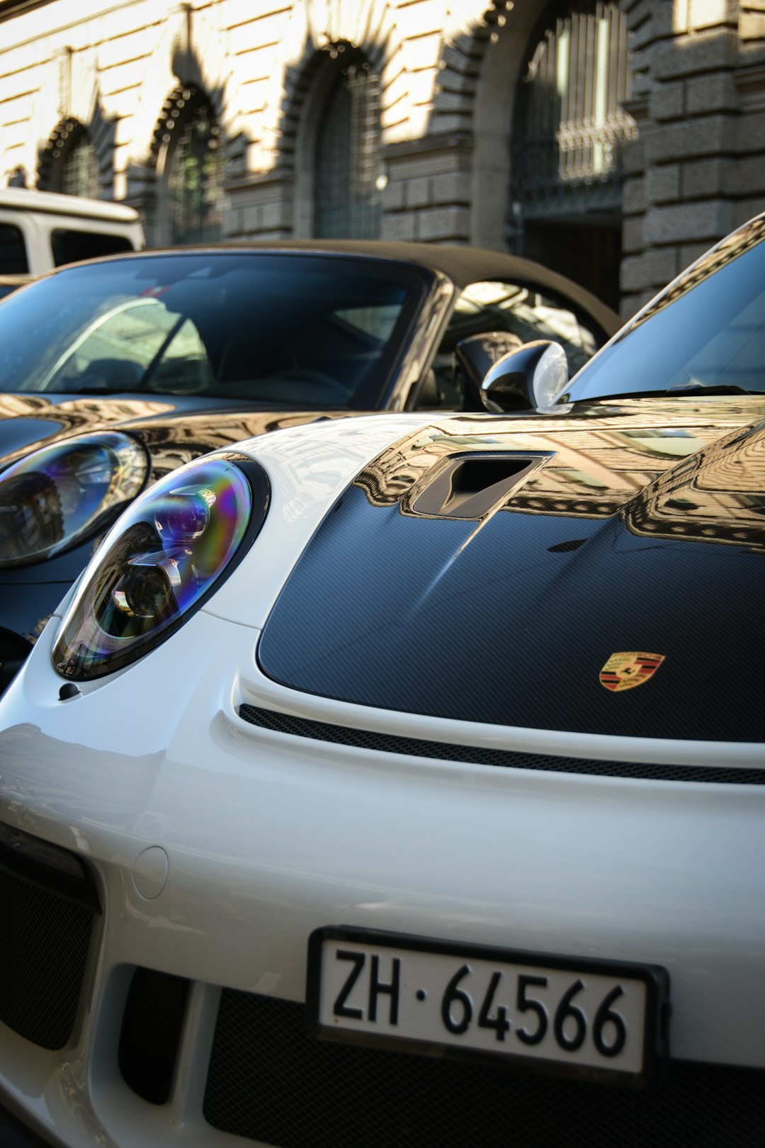 silver porsche 911 parked on street during daytime