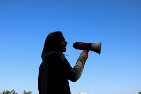 woman speaking into a megaphone