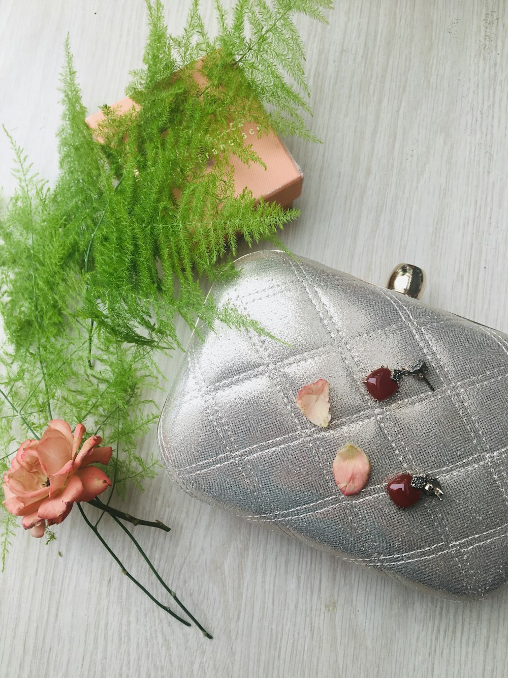 silver leather pouch with red beads