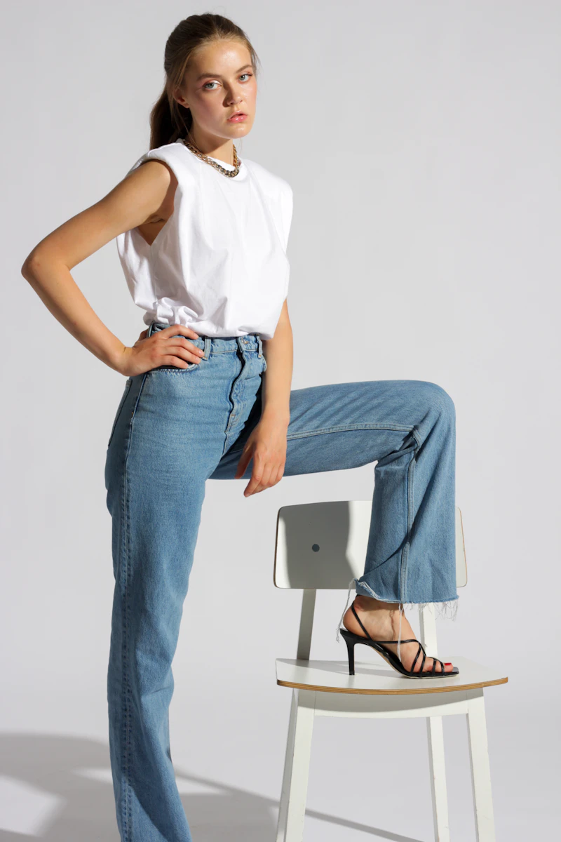 White cotton poplin shirt laid flat showing relaxed silhouette